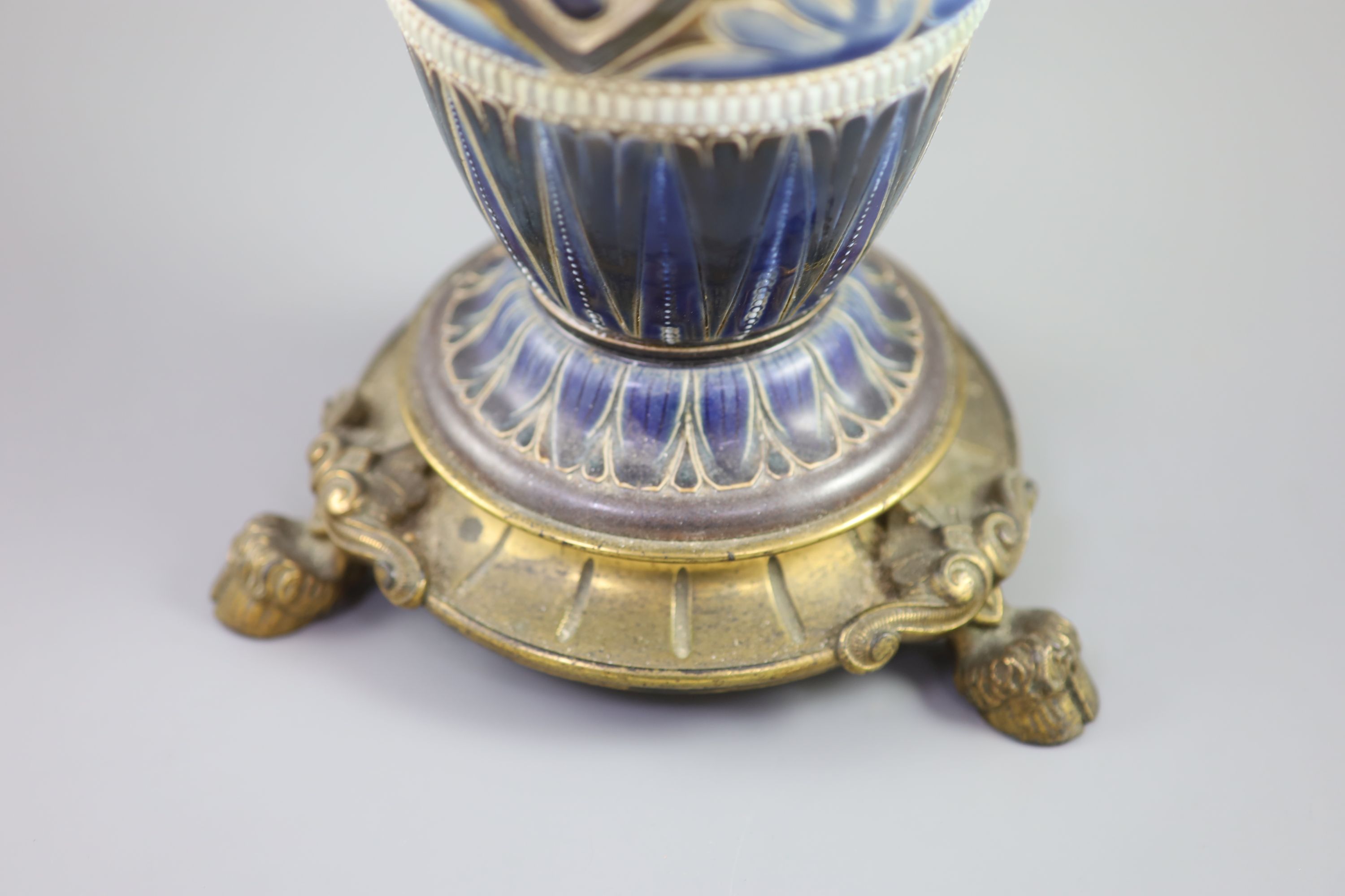 A large Doulton Lambeth stoneware oil lamp, by Edith D. Lupton, dated 1880, 50.5cm high excluding glass chimney and shade
